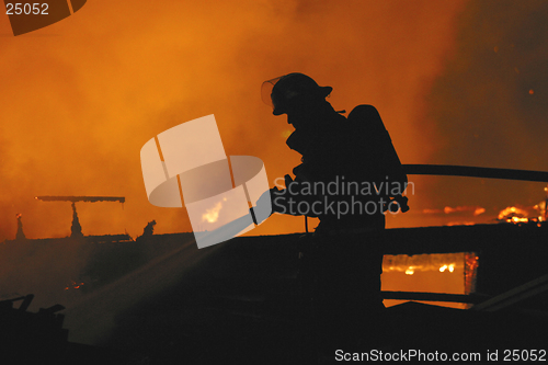 Image of firefighter in silhouette