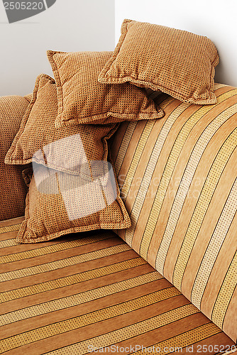 Image of striped brown sofa and four pillows