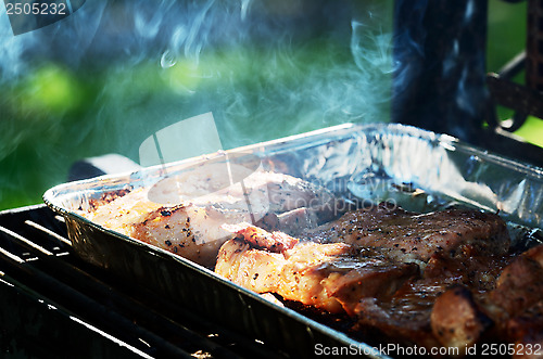 Image of meat is roasted on the grill