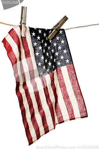 Image of american flag on a clothesline with wooden clothespins