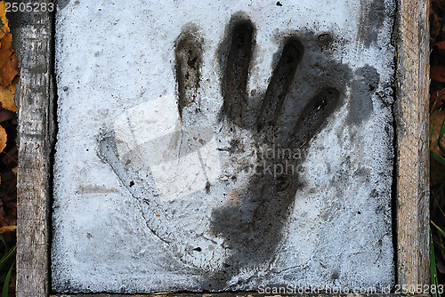 Image of handprint in cement