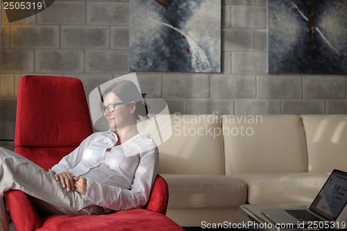Image of woman using a laptop computer at home