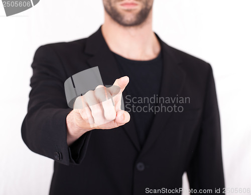 Image of Businessman pressing an imaginary button