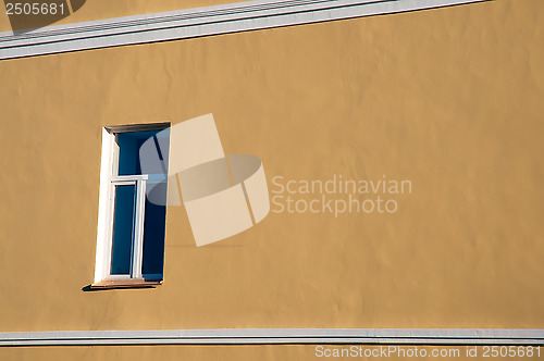 Image of The window on the yellow wall.