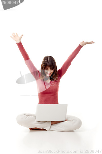 Image of Happy woman with a laptop