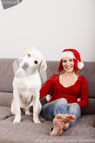 Image of Woman with her dog on Christmas Day