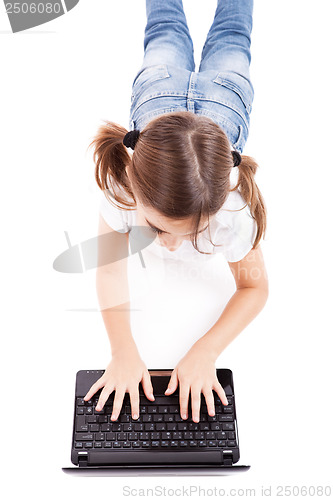 Image of Little student girl with a laptop