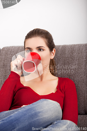 Image of Woman relaxing with a coffee