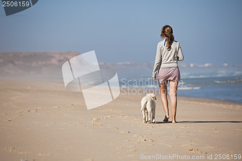 Image of Walking with her dog