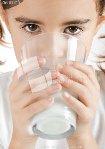 Image of Little girl drinking milk