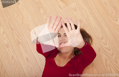 Image of Woman lying on the floor