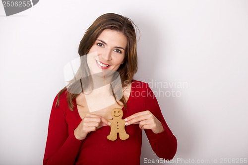 Image of Woman with a Gingerbread cookie