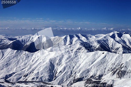 Image of Snowy mountains and sky with clouds