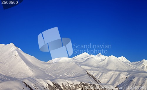 Image of Snowy mountains and blue clear sky