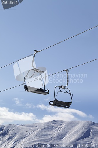 Image of Chair lifts and off piste slope at nice day