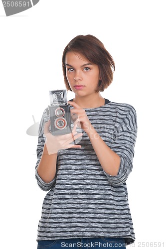 Image of Lovely teenage girl with retro photo camera