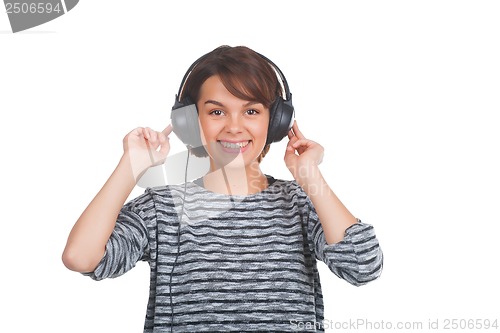 Image of Pretty young girl listening music