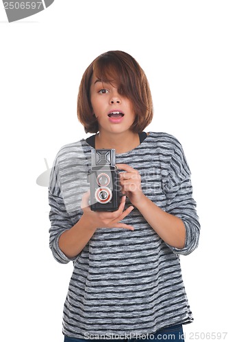 Image of Lovely teenage girl with retro photo camera