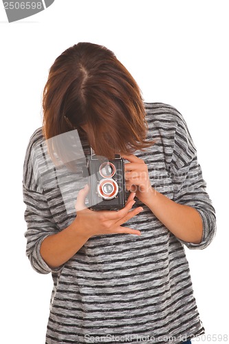 Image of Lovely teenage girl with retro photo camera