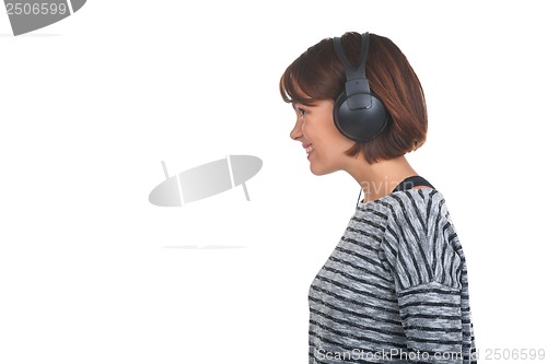 Image of Pretty young girl listening music