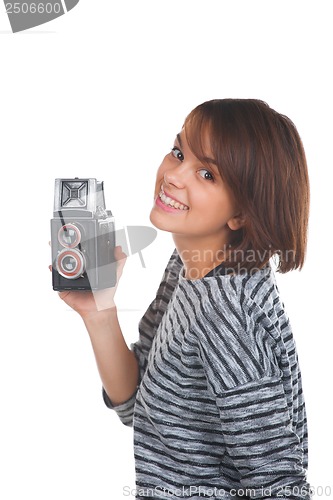 Image of Lovely teenage girl with retro photo camera