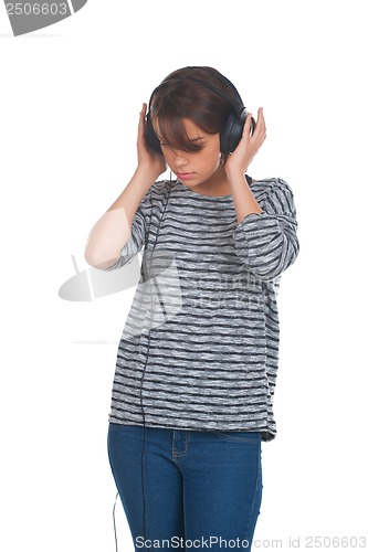 Image of Pretty young girl listening music