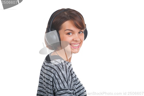 Image of Pretty young girl listening music