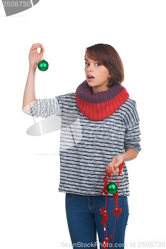 Image of Young woman with christmas ball