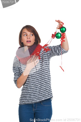 Image of Young woman with christmas ball