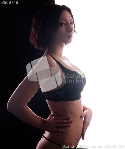 Image of young woman in black lingerie