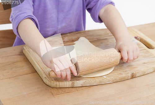 Image of rolling out dough for pizza