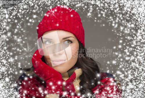 Image of Mixed Race Woman Wearing Winter Hat and Gloves Enjoys Snowfall
