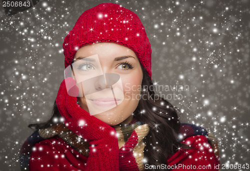 Image of Mixed Race Woman Wearing Winter Hat and Gloves Enjoys Snowfall
