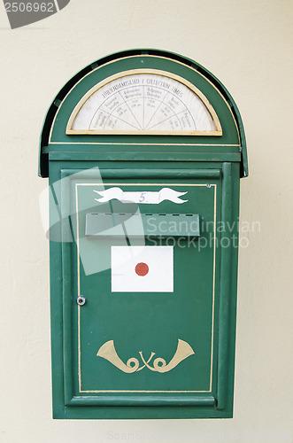 Image of Ancient green mail box a close up