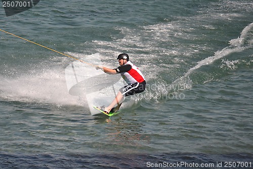 Image of the athlete of water skiing on a water ski