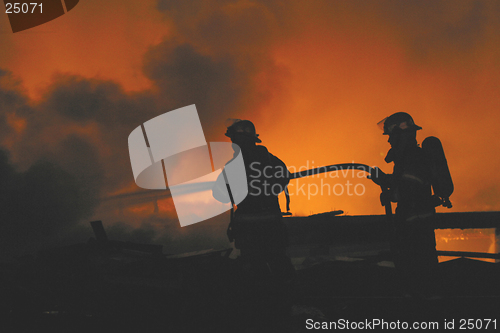 Image of firefighters in silhouette