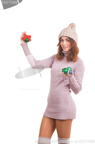 Image of Young woman with christmas ball