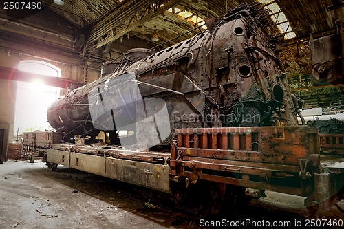 Image of Old industrial locomotive in the garage