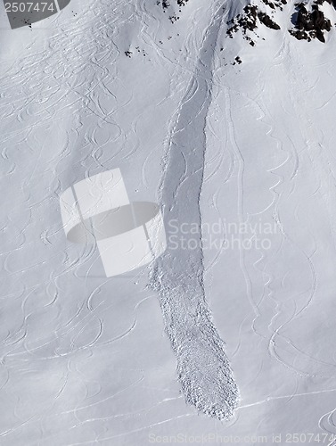 Image of Off piste slope with trace of skis, snowboarding and avalanche