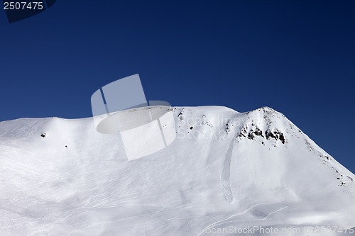 Image of Off-piste slope with trace of skis, snowboarding and avalanche