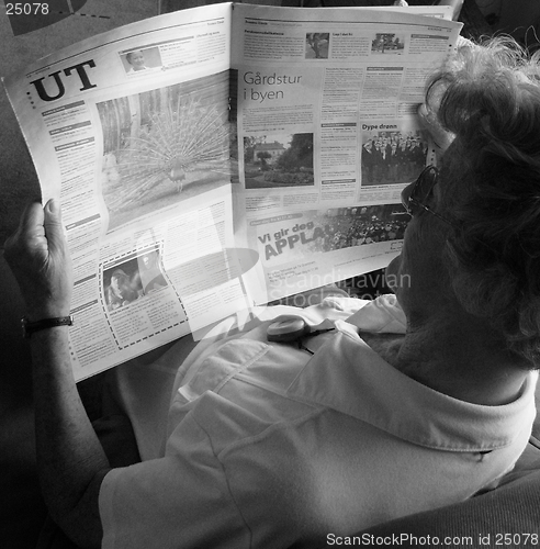 Image of Reading the paper