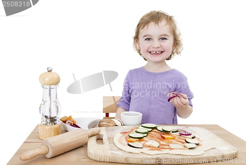 Image of happy child making pizza