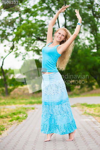 Image of Barefooted blond woman