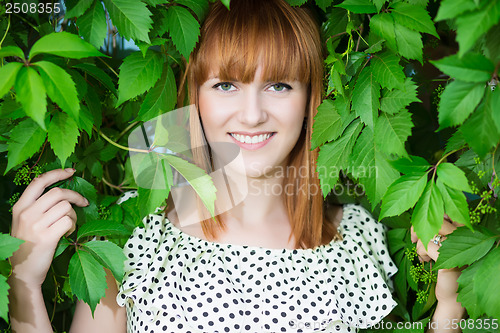 Image of Smiling redhead woman
