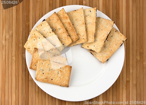 Image of Pile of chocolate chip cookies on a dish