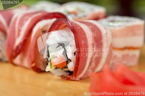 Image of Sushi roll with bacon