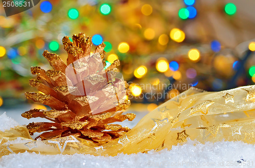 Image of Two golden pine cone