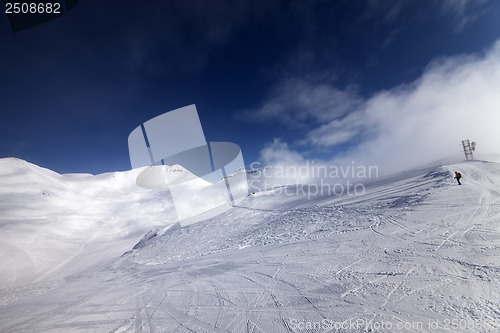 Image of Skier on start of ski slope