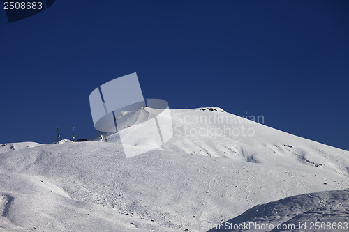 Image of Off-piste slope with traces of skis at nice sunny day