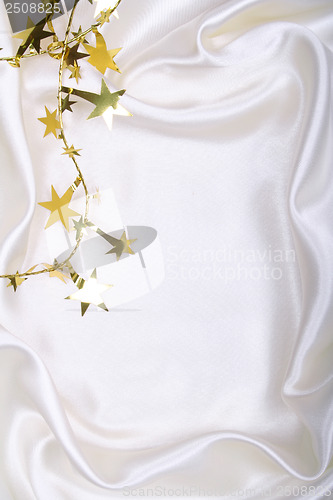 Image of Golden stars and spangles on white silk
